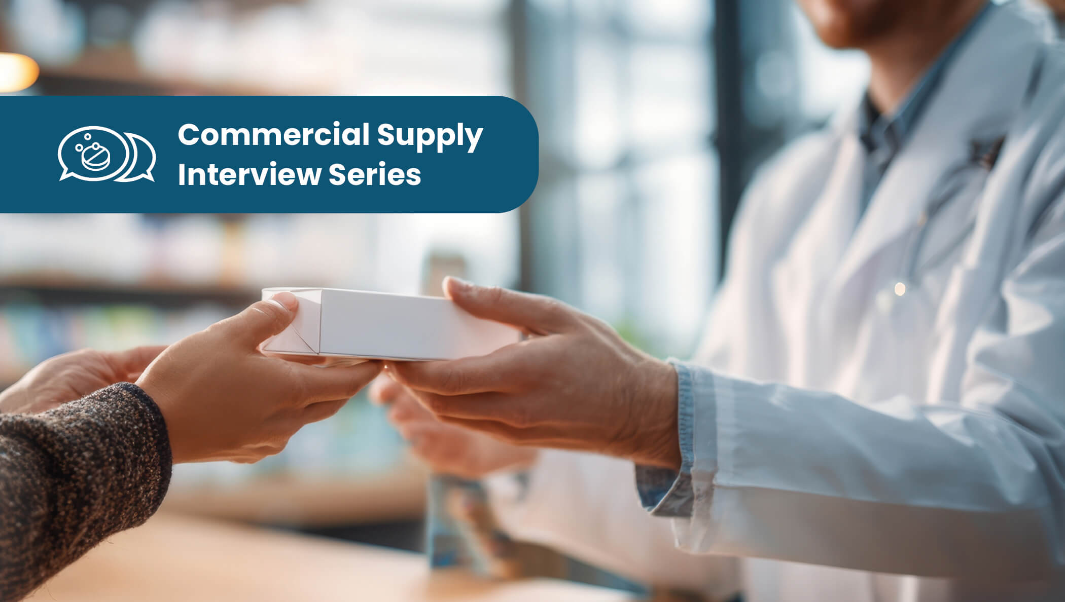 Pharmacist hands a medication box to a customer in a pharmacy setting.