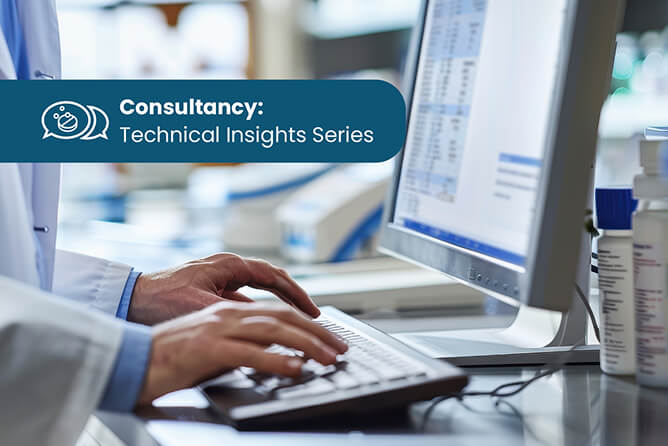 Lab technician typing on keyboard